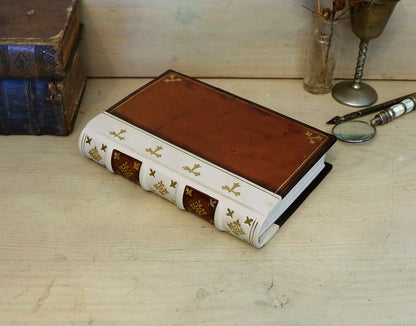 Antiqued journal, Orange-brown leather cover with white leather spine, Gold tooled decoration. The Book of Light