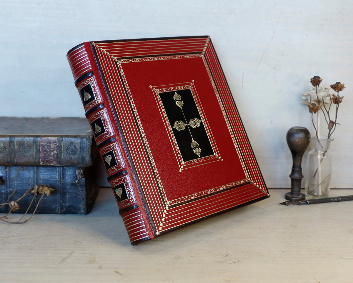 Bright red leather journal with black inlays and gold tooled decoration - The Gilded Labyrinth