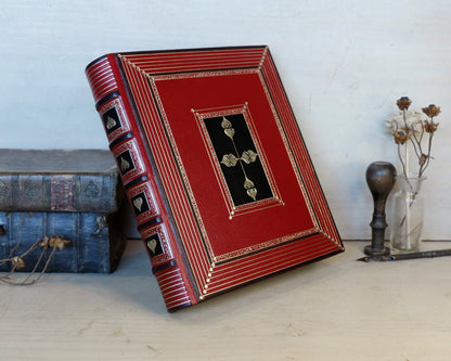 Bright red leather journal with black inlays and gold tooled decoration - The Gilded Labyrinth