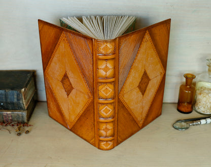 Antiqued orange leather journal with tooled decoration. Romantic Sunset II