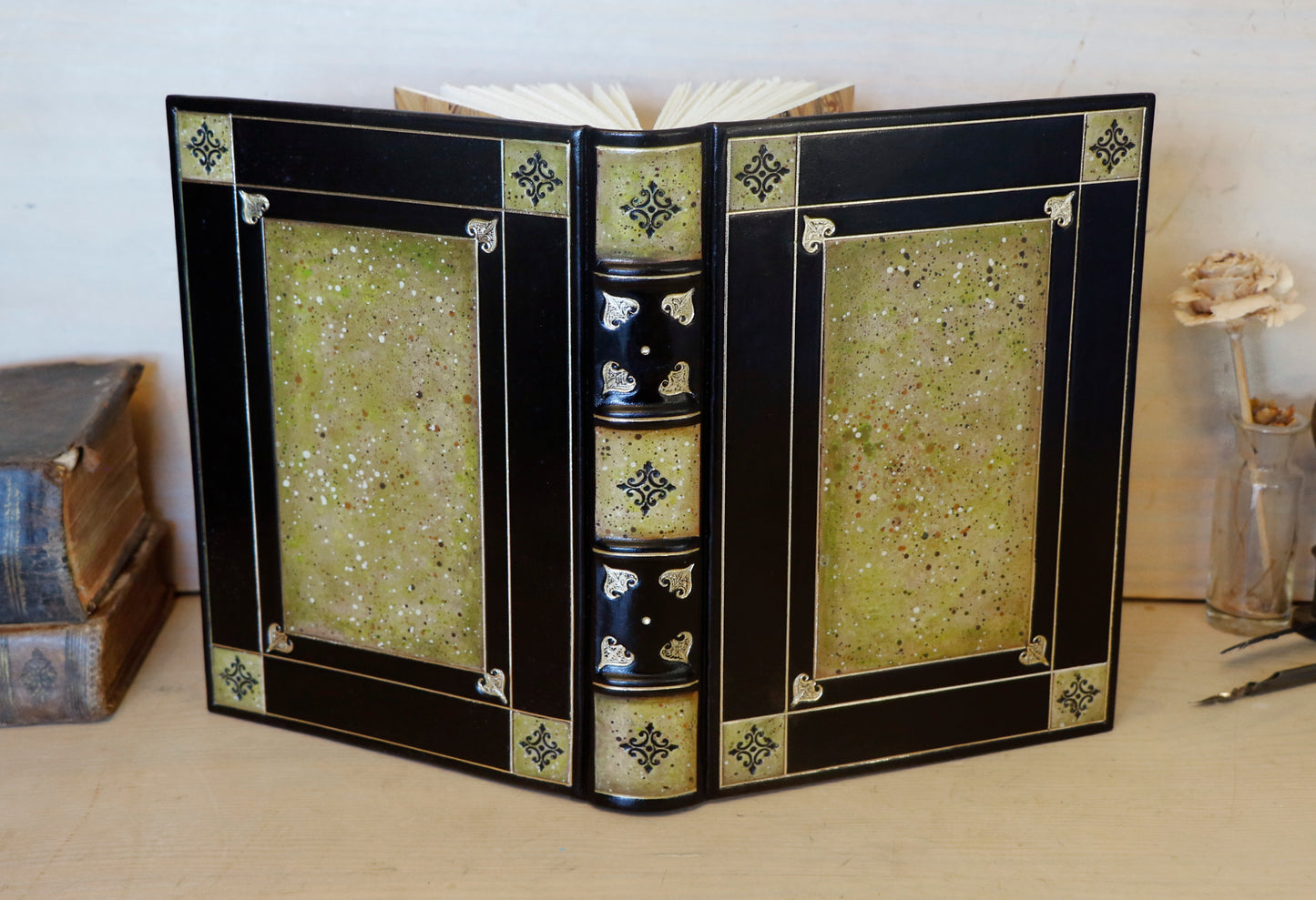 Black leather journal with tooled and hand painted decoration. Artist paper. Verdigris Dreams