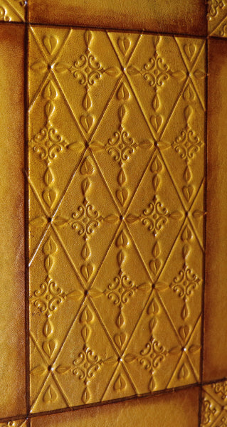 Antiqued yellow leather journal with tooled decoration. Romantic Sunset