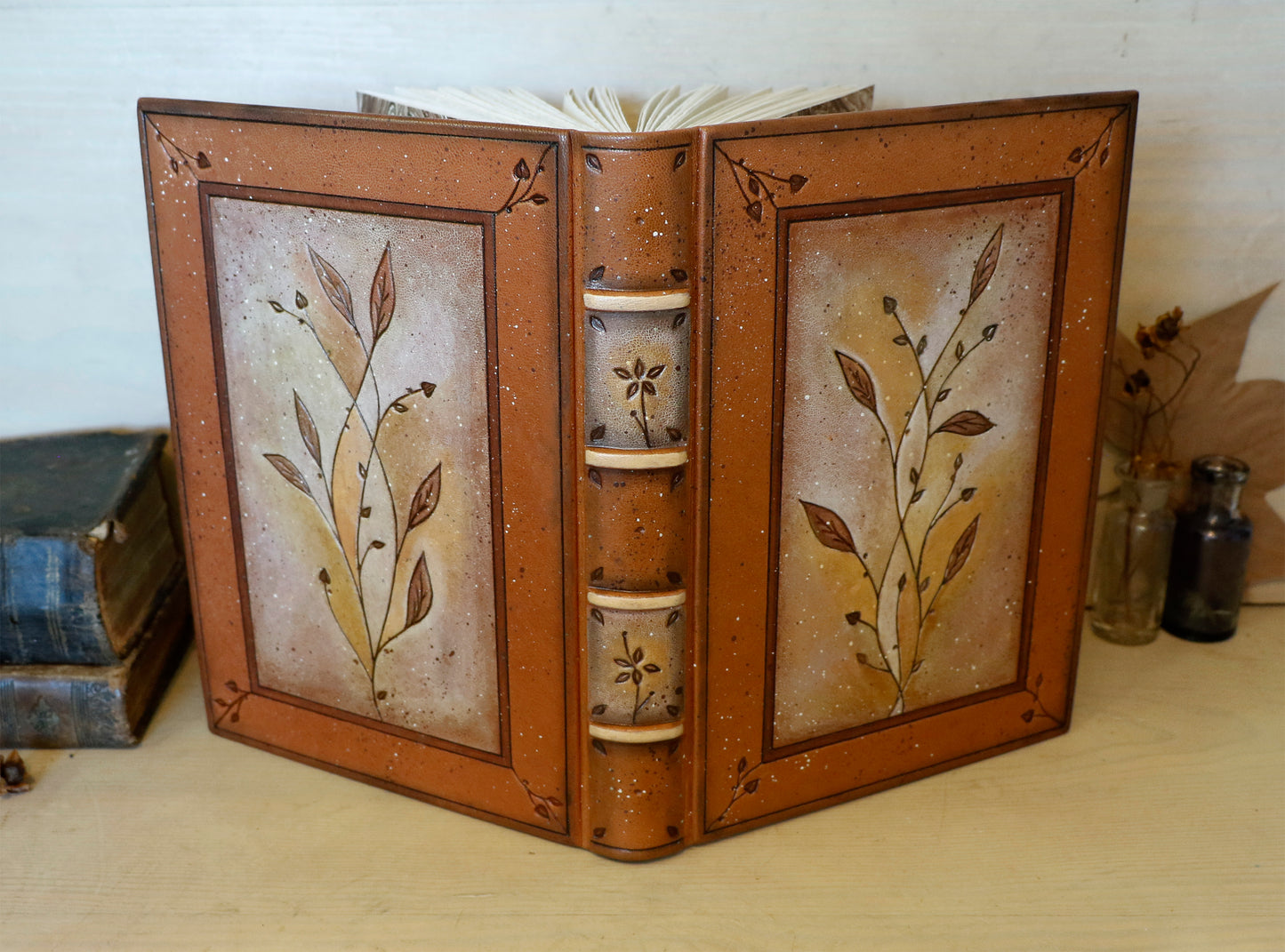 Brown leather journal with tooled floral decoration . Romantic Journey