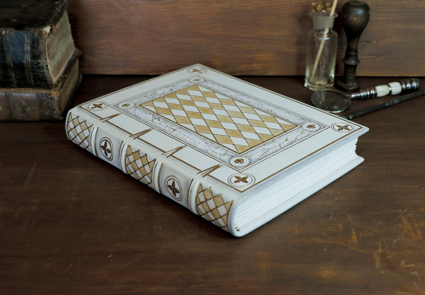 Ivory Dreams. White leather journal with gold tooled and painted decoration. One of a kind.