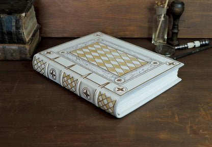 Ivory Dreams. White leather journal with gold tooled and painted decoration. One of a kind.
