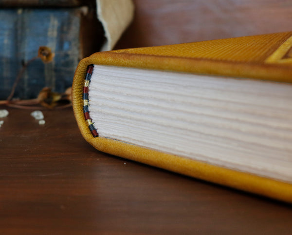 Antiqued yellow leather journal with tooled decoration. Romantic Sunset