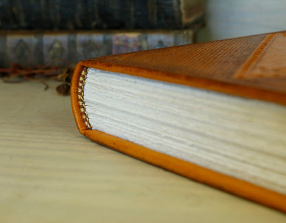Antiqued orange leather journal with tooled decoration. Romantic Sunset II
