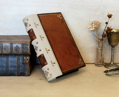 Antiqued journal, Orange-brown leather cover with white leather spine, Gold tooled decoration. The Book of Light
