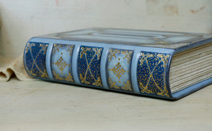 Antiqued baby blue leather journal with gold tooled decoration. Celestial Whisper