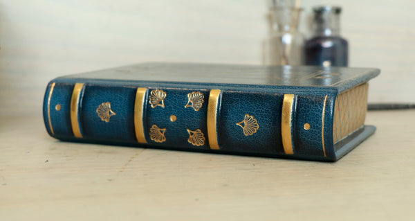 Blue leather journal with gold tooled decoration and painted edges. A Small Treasure