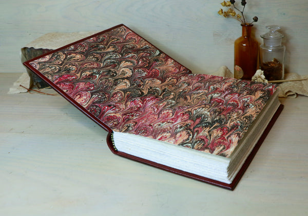Antiqued red leather journal with cross decoration. One of a Kind - Faith