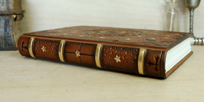 Brown leather journal with tooled decoration, The Circle of Time in Black