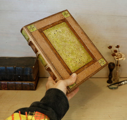 Brown leather journal with tooled and hand painted decoration. Artist paper. Mosslight