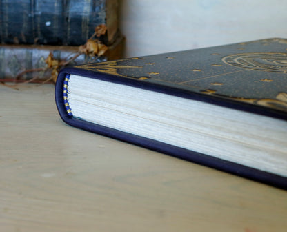 Dark blue leather journal with gold tooled decoration, The Circle of Time