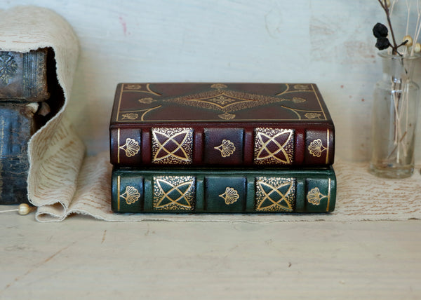 Set of 2 Small Leather Journals, Dark red and green leather with gold tooled decoration and antiqued paper. Antiquarian’s Notes