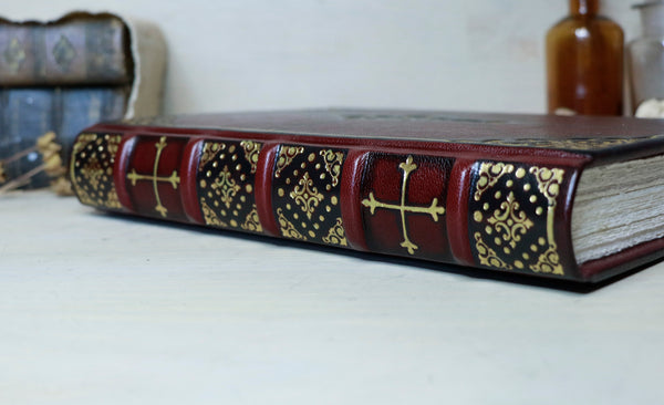 Antiqued red leather journal with cross decoration. One of a Kind - Faith