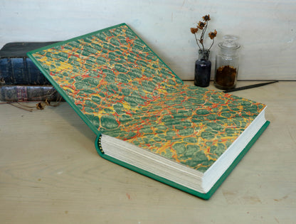 Green leather journal with gold tooled decoration, The Circle of Time