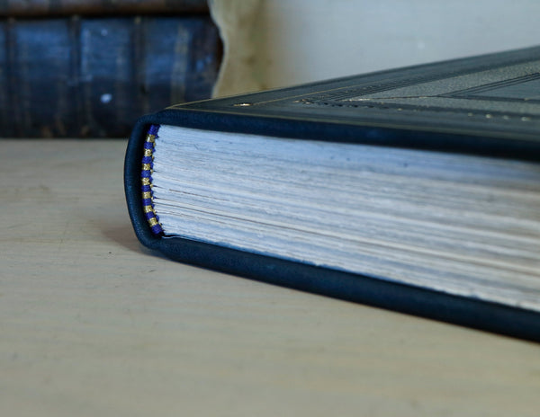 Dark Blue Leather Journal with gold floral decoration. The Midnight Garden