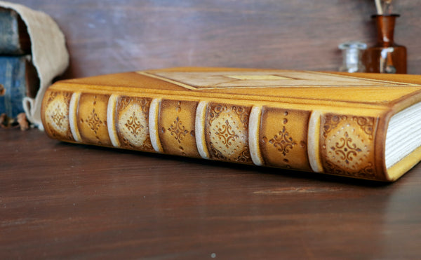 Antiqued yellow leather journal with tooled decoration. Romantic Sunset