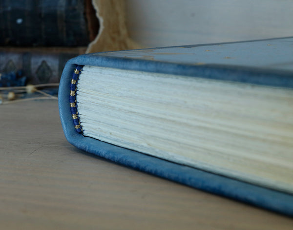 Light blue leather journal with gold tooled decoration, The Circle of Time