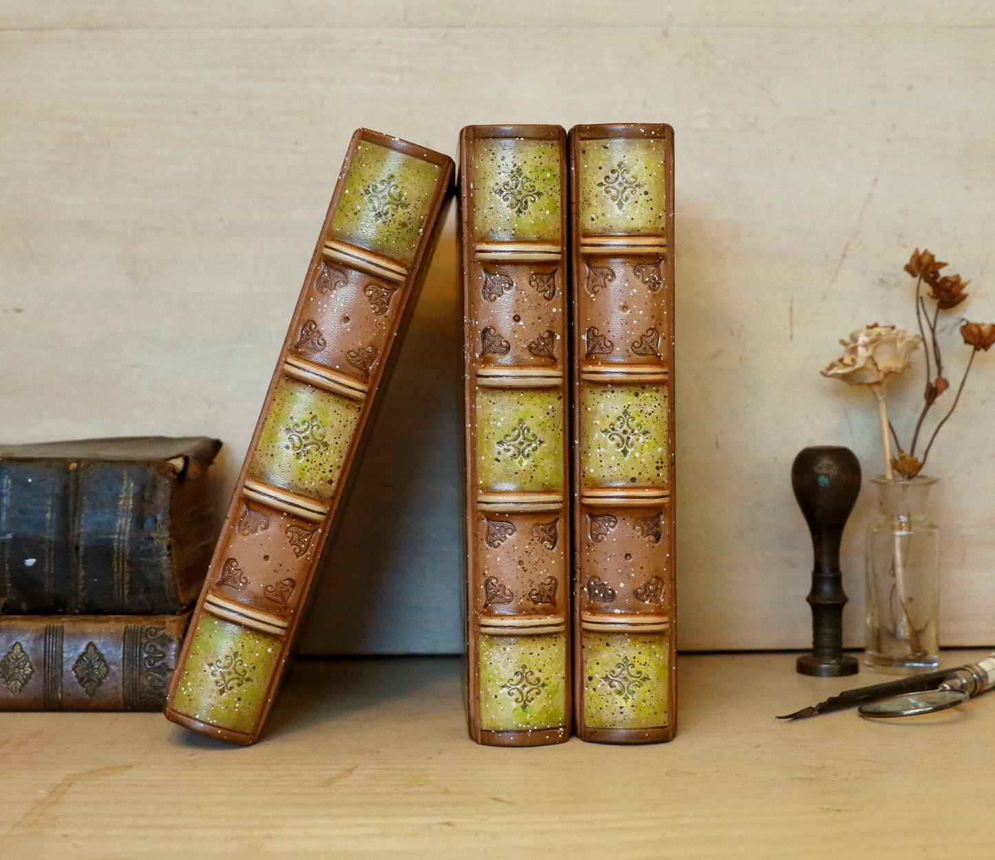 Brown leather journal with tooled and hand painted decoration. Artist paper. Mosslight
