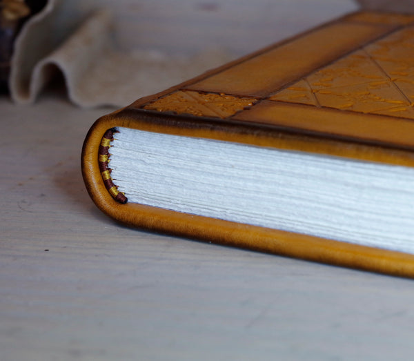 Antiqued yellow leather journal with tooled decoration. Romantic Sunset