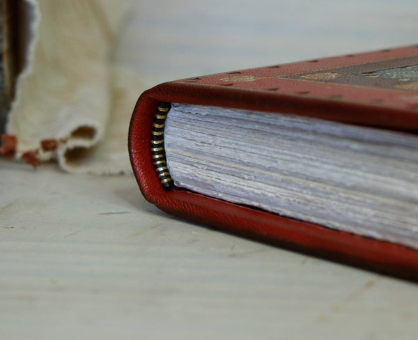 Small journal, red leather with black inlays and gold tooled decoration - Words of Passion