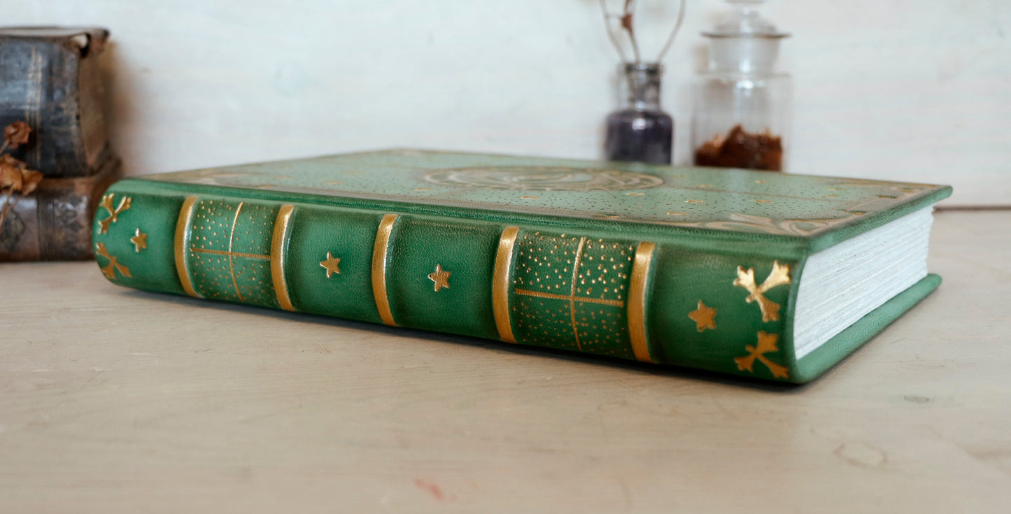 Green leather journal with gold tooled decoration, The Circle of Time