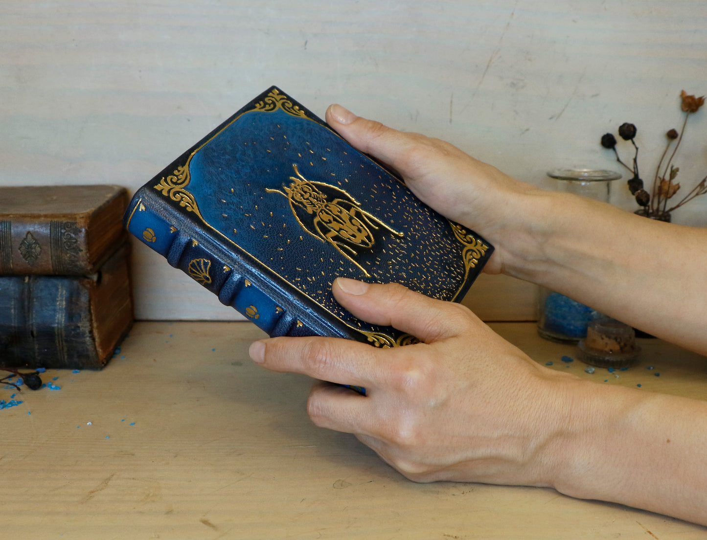 Blue leather journal with gold tooled decoration. Scarab of the Night