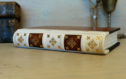 Antiqued journal, Orange-brown leather cover with white leather spine, Gold tooled decoration. The Book of Light