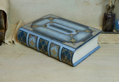 Antiqued baby blue leather journal with gold tooled decoration. Celestial Whisper