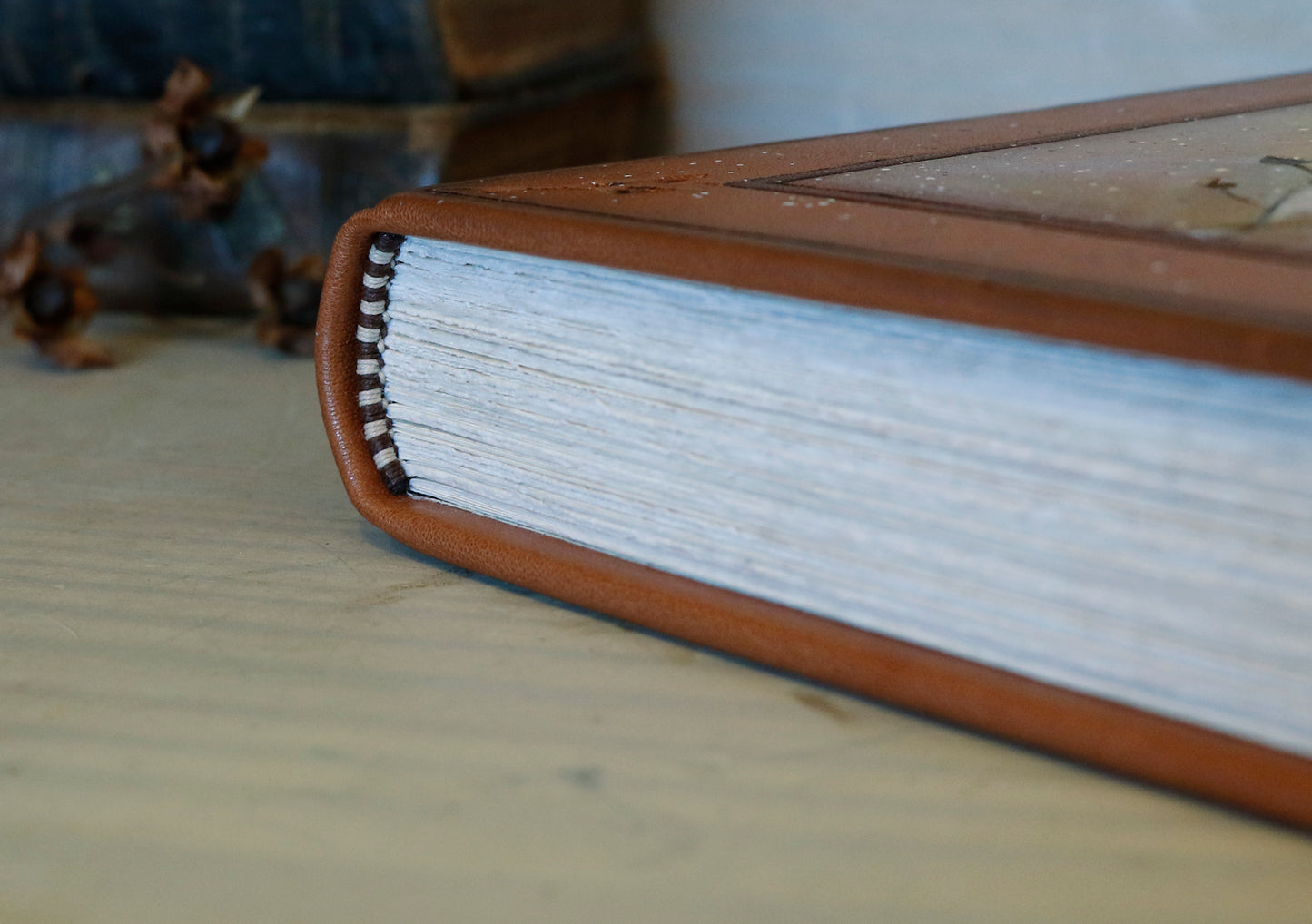 Brown leather journal with tooled floral decoration . Romantic Journey