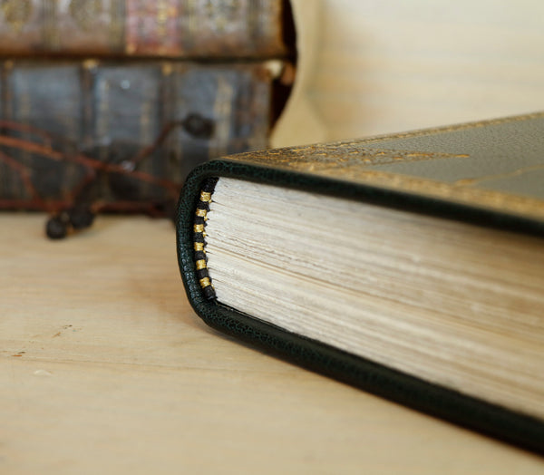 Dark Green Leather Journal with gold floral decoration. Romantic Journey
