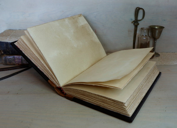 Large vintage leather journal, Tooled decoration with Dragon and Sword. Tea stained pages. "The Force within You"