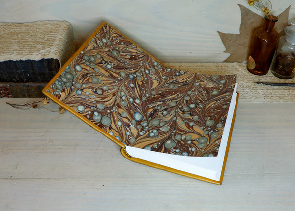 Antiqued yellow leather journal with tooled decoration. Romantic Sunset