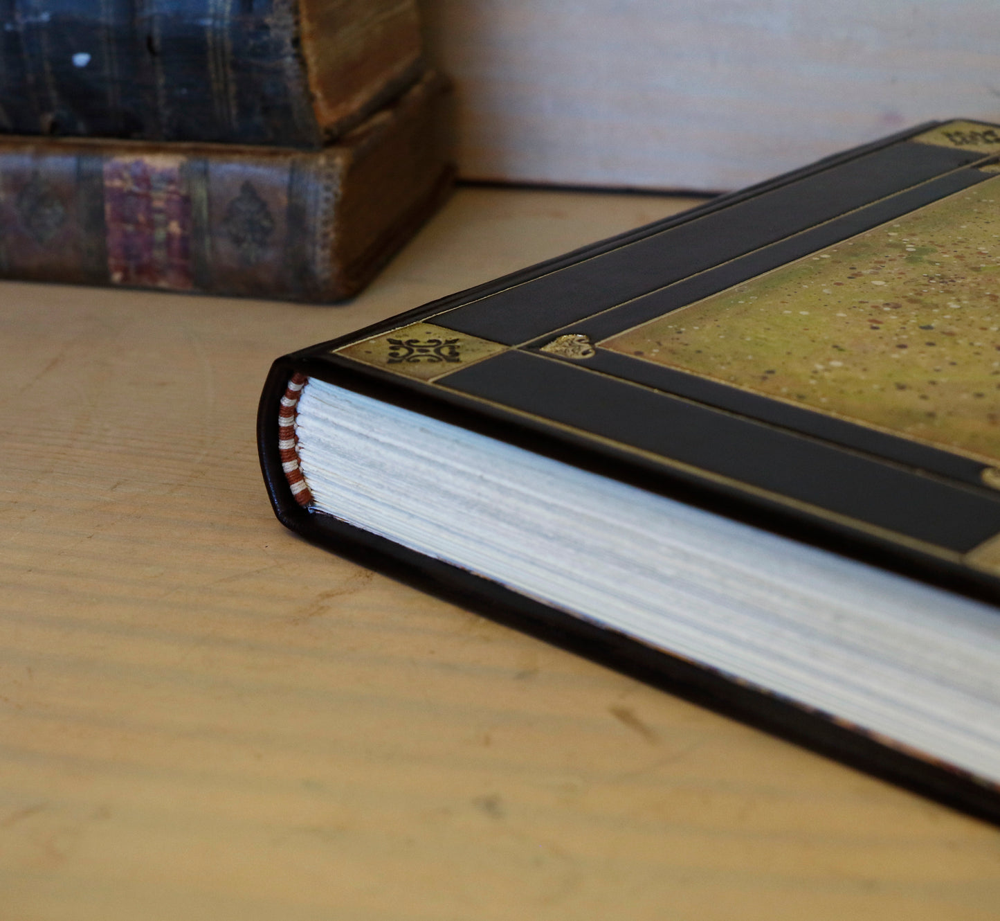 Black leather journal with tooled and hand painted decoration. Artist paper. Verdigris Dreams