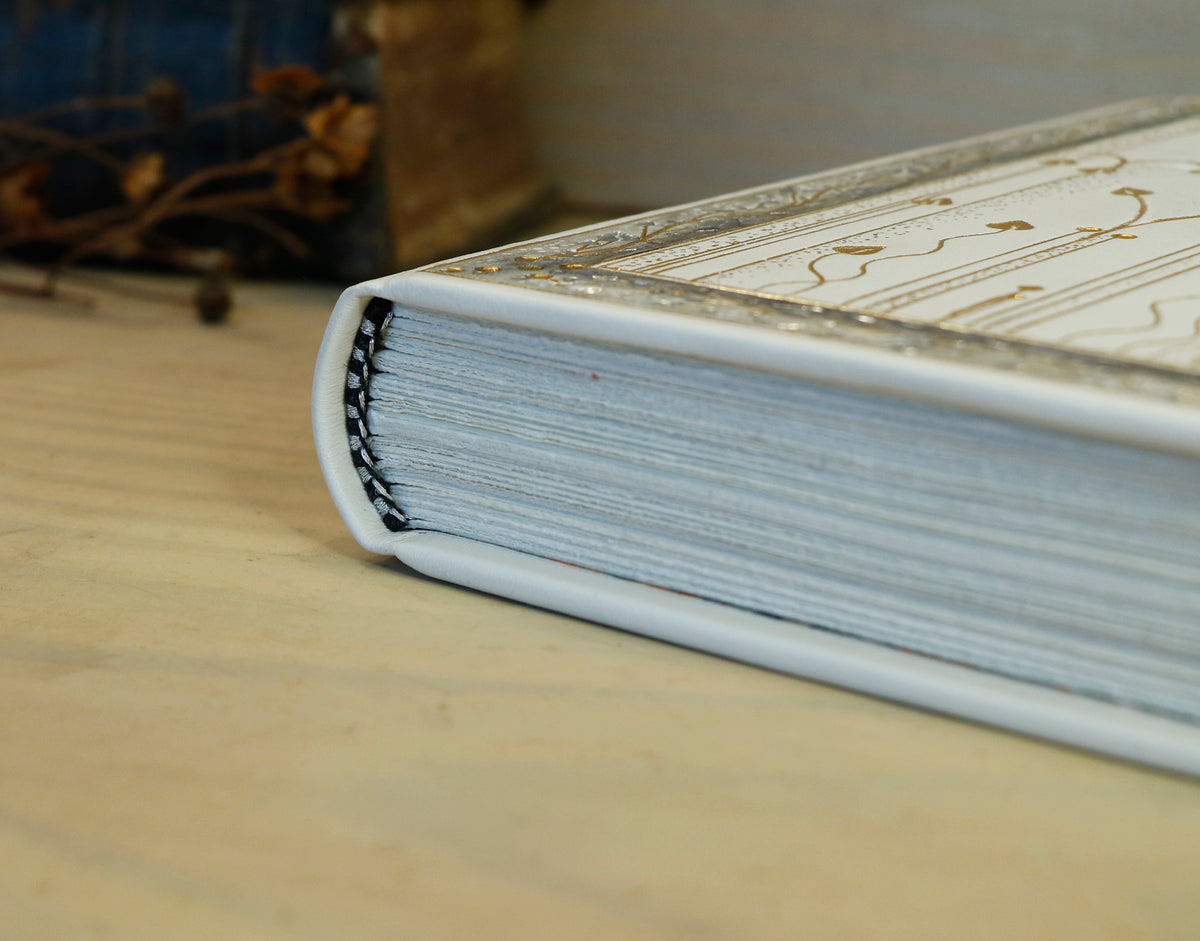 Ivory Dreams. White leather journal with gold and silver tooled decoration. One of a kind.