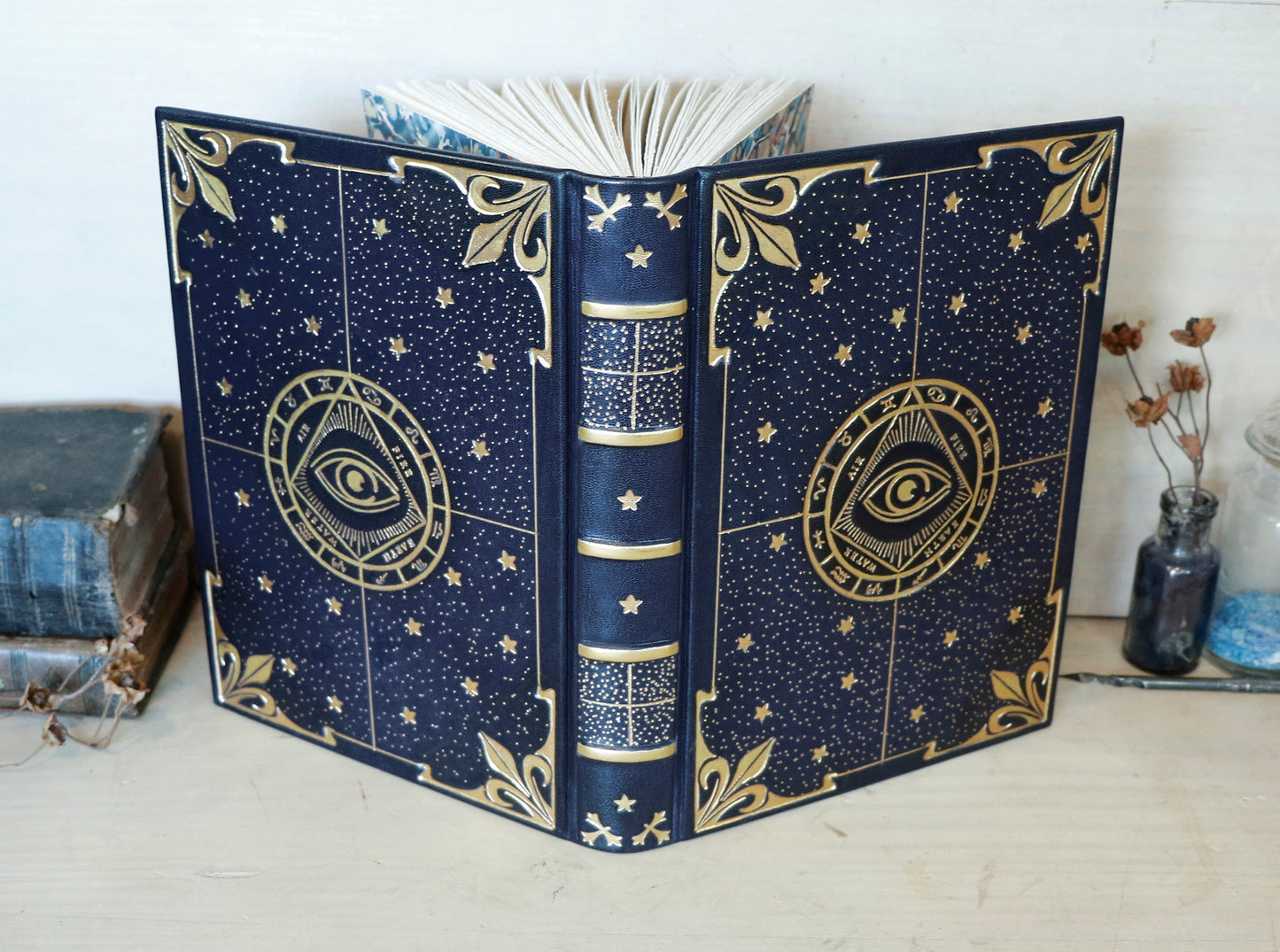 Dark blue leather journal with gold tooled decoration, The Circle of Time