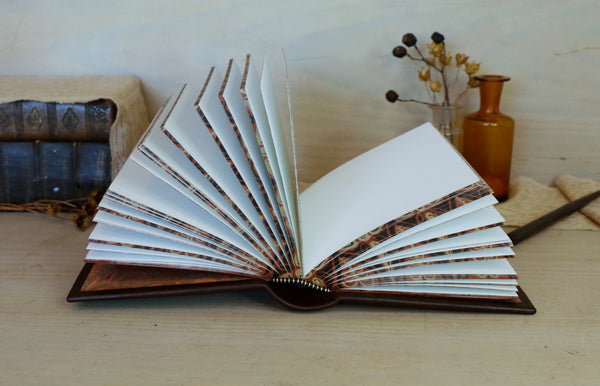 Leather journal with painted edges. Gold tooled and hand painted decoration. Secret Treasure