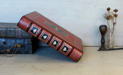 Bright red leather journal with black inlays and gold tooled decoration - The Gilded Labyrinth