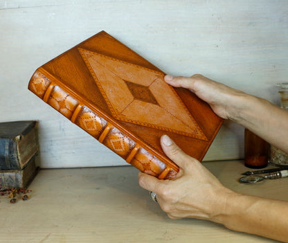 Antiqued orange leather journal with tooled decoration. Romantic Sunset II