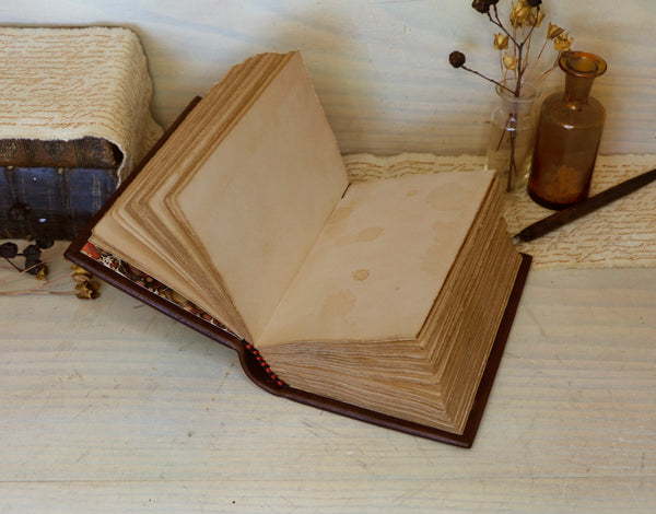 Brown leather journal with blind tooled decoration, Tea stained pages. Dark Chocolate