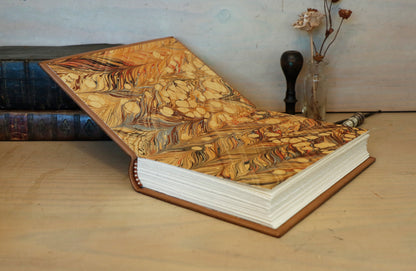 Brown leather journal with tooled and hand painted decoration. Artist paper. Mosslight