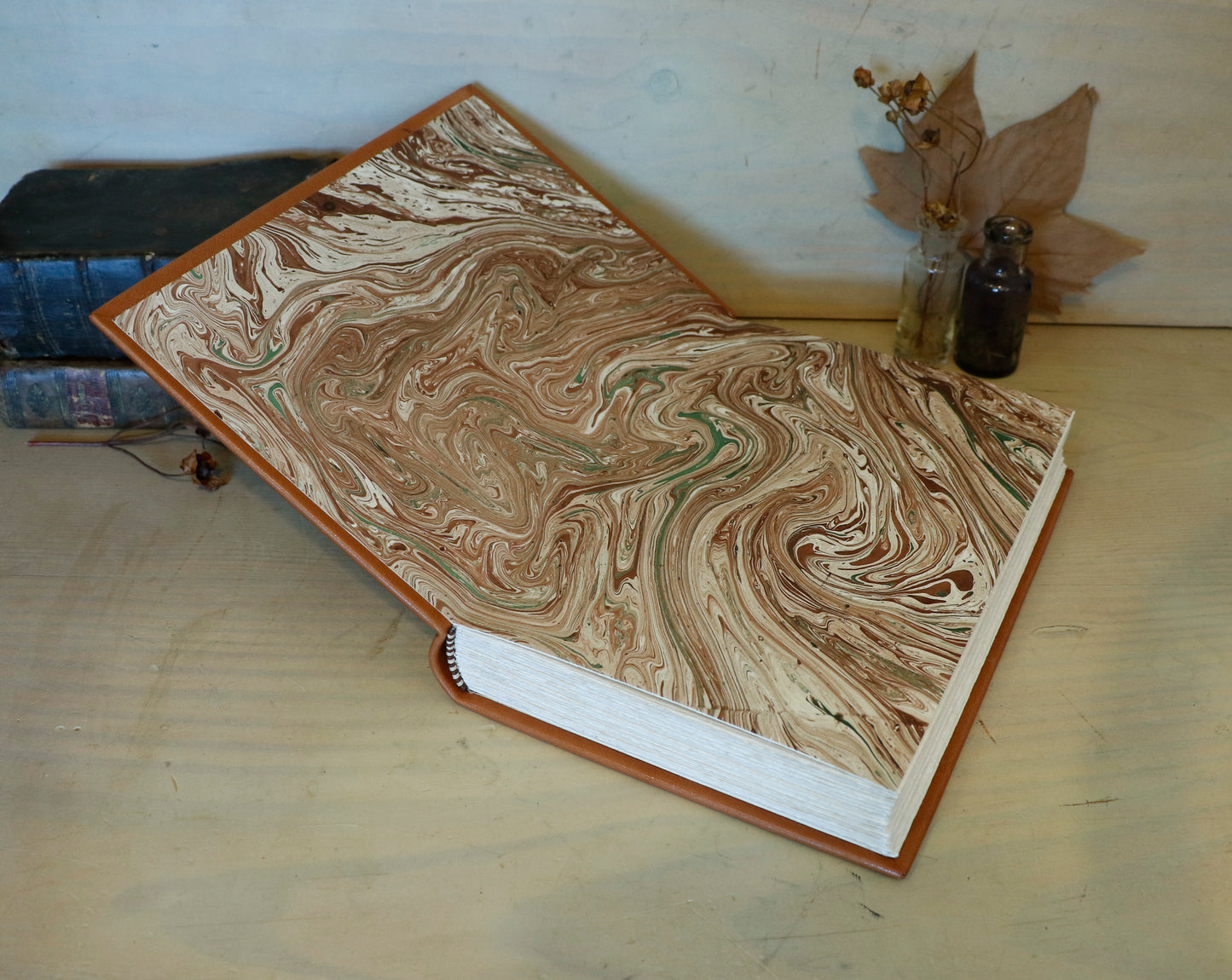 Brown leather journal with tooled floral decoration . Romantic Journey