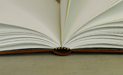 Brown leather journal with tooled decoration, The Circle of Time in Gold