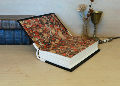 Antiqued journal, Orange-brown leather cover with white leather spine, Gold tooled decoration. The Book of Light