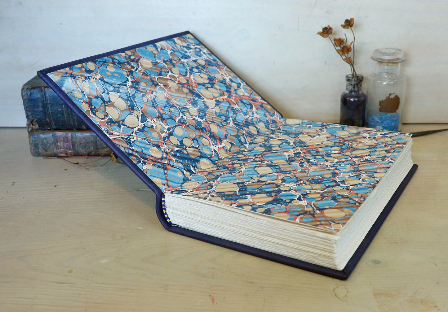 Dark blue leather journal with gold tooled decoration, The Circle of Time