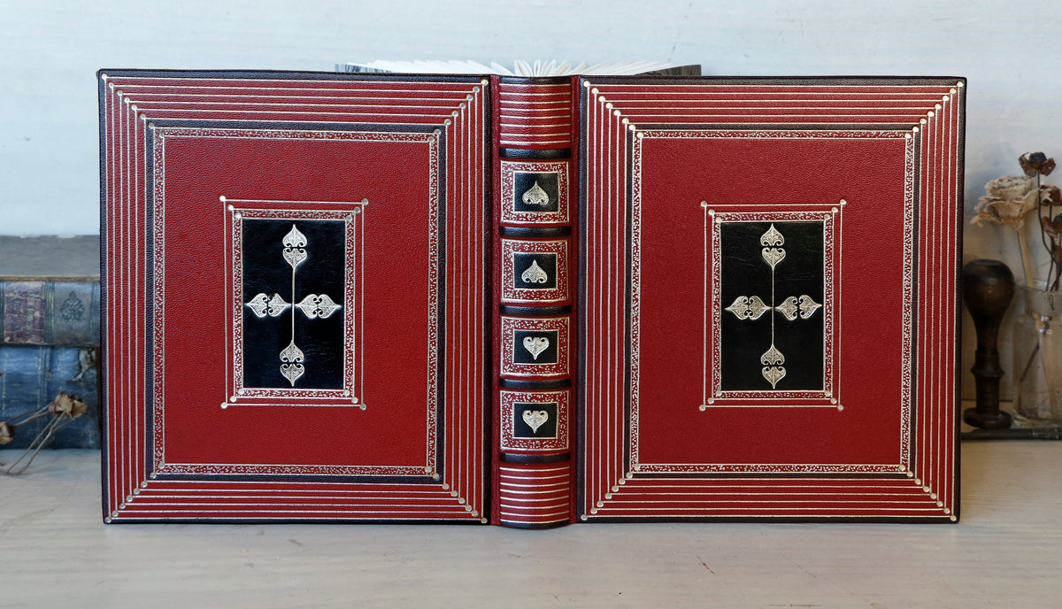 Bright red leather journal with black inlays and gold tooled decoration - The Gilded Labyrinth