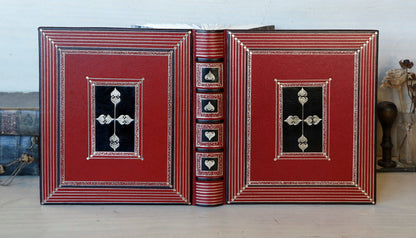 Bright red leather journal with black inlays and gold tooled decoration - The Gilded Labyrinth