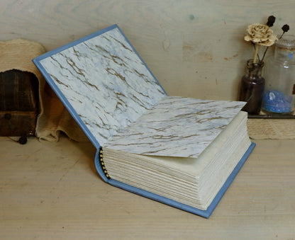 Antiqued baby blue leather journal with gold tooled decoration. Celestial Whisper